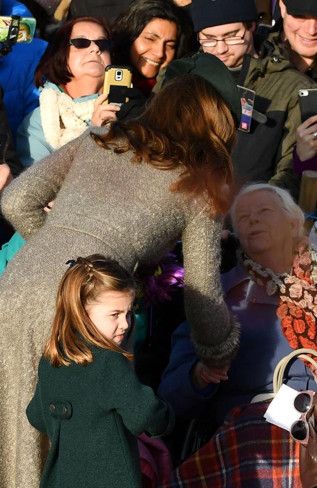 Princess Charlotte greets fans with her mum. Picture: AFP