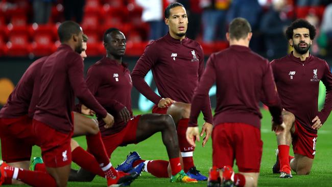 Virgil van Dijk, centre, exudes an air of calm at the heart of the Liverpool defence