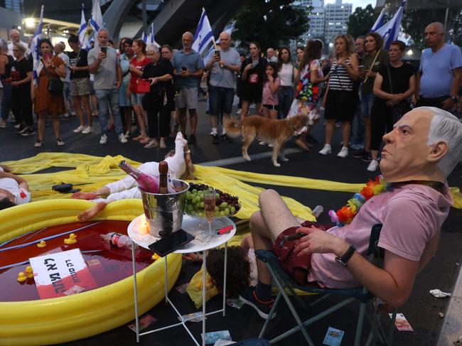 Protesters during an anti-government rally in Tel Aviv, ahead of Benjamin Netanyahu’s trip to Washington. Picture: AFP