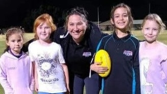 Cristelle Mulvogue, middle, with some of the club's Auskick kids.