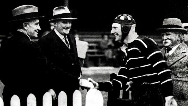 **FEE MAY APPLY** 1935: Dave Brown is congratulated by Dally Messenger (L) after Easts v Balmain game circa 1935, in which he broke his point scoring record. Pic Courtesy of Ian Collis. Historical Rugby League