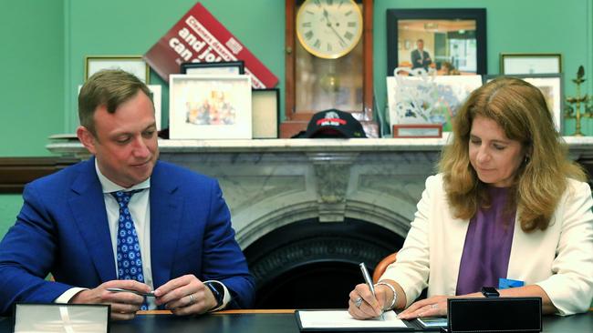 Deputy Premier Steven Miles and Rio Tinto Chief Executive Kellie Parker sign the deal.