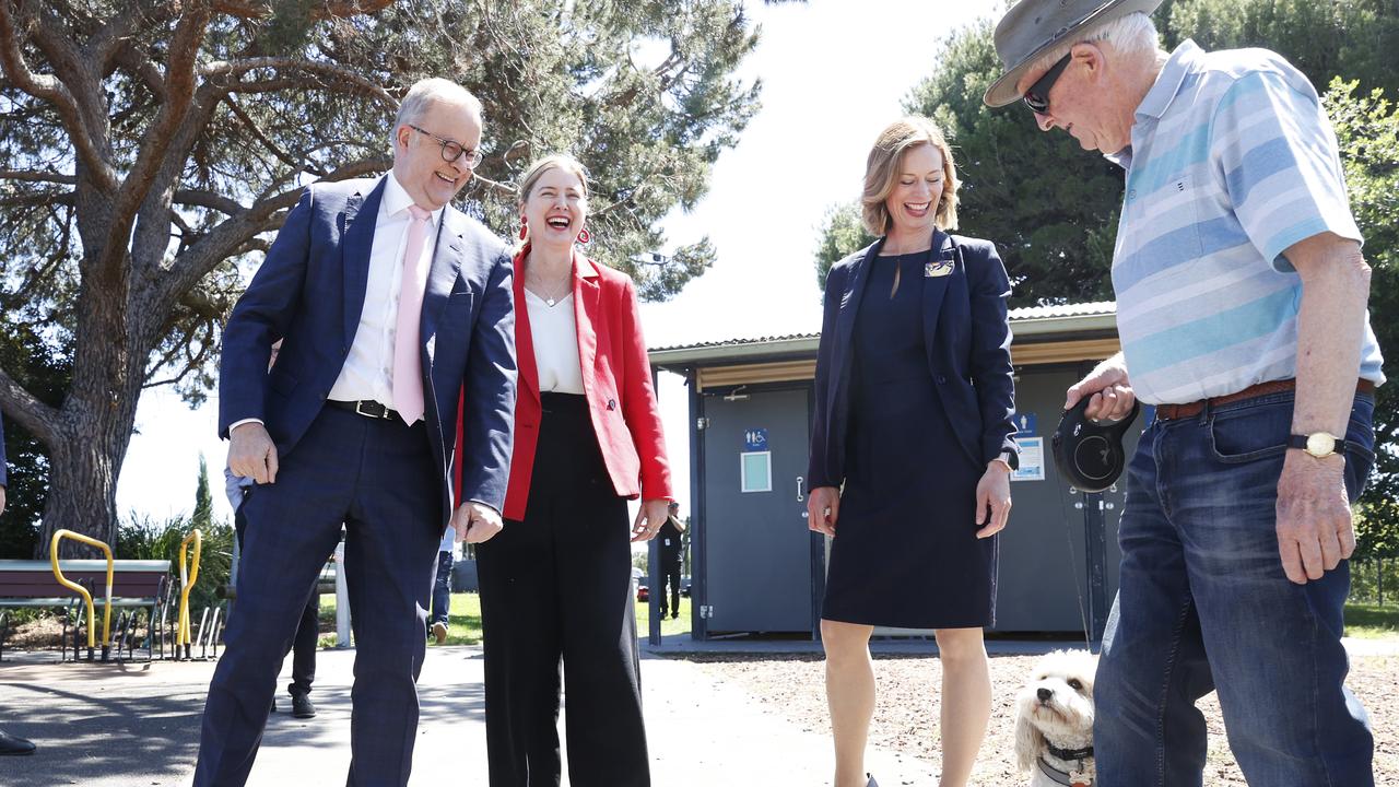 Prime Minister Anthony Albanese with Minister Julie Collins, Labor candidate for Lyons Rebecca White and Graeme Evans of Sorell with his dog Darcy. Picture: Nikki Davis-Jones