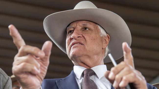 ‘She won by at least this much’ ... Federal MP Bob Katter is swimming with the Sharkie. Photo: AAP