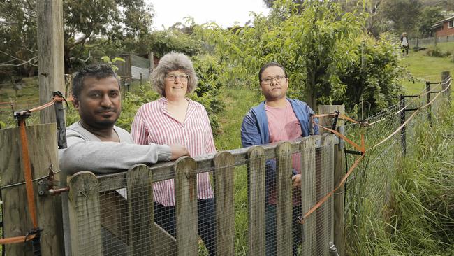 Wildlife research associate professor Menna Jones with some of the students who have surveyed Hobart residents about urban wildlife, Bharath Kumar Golivadda, left, and Bikas Giri. Picture: MATHEW FARRELL