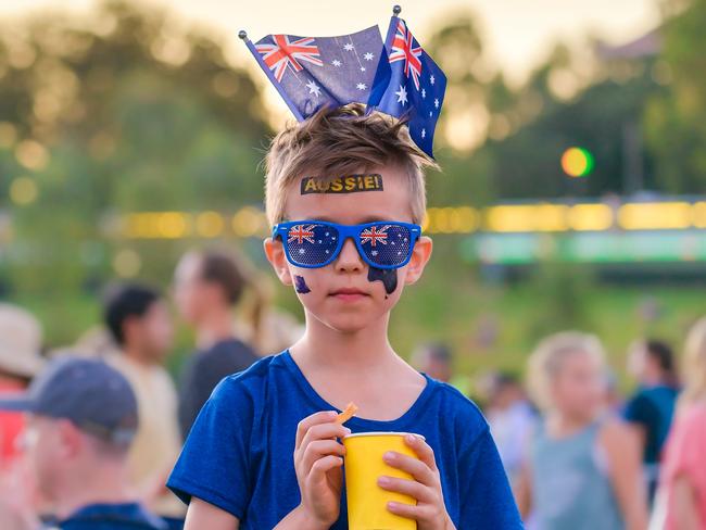 Cute Australian boy with flag tattoos on his face on Australia Day celebration in Adelaide