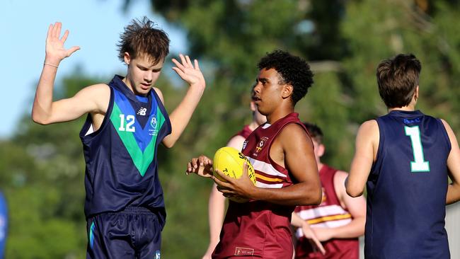 AIC AFL seniors match between Ambrose Treacy College and St Peters Lutheran College.