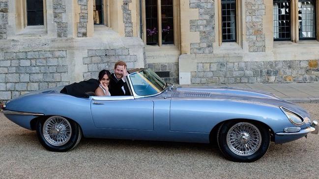 Prince Harry and Meghan Markle in an E-Type Jaguar after their wedding. Source: Twitter