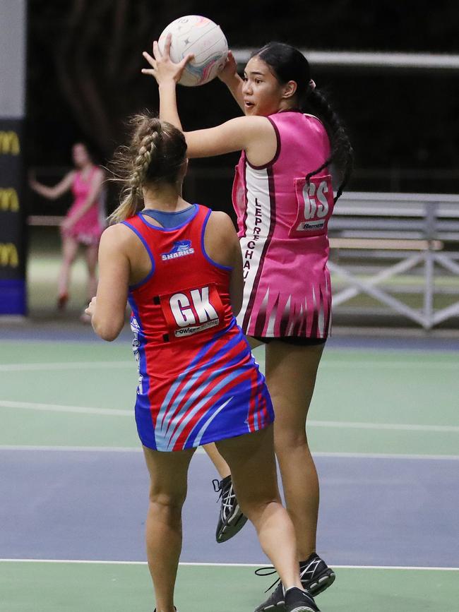 Sara-Lee Tikitau looks to offload the ball in the Cairns Netball match between Leprechauns and Sharks. PICTURE: BRENDAN RADKE