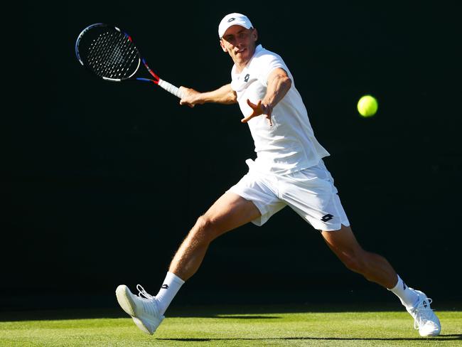 LONDON, ENGLAND - JULY 02:  John Millman of Australia returns against Stefano Travaglia of Italy during their Men's Singles first round match on day one of the Wimbledon Lawn Tennis Championships at All England Lawn Tennis and Croquet Club on July 2, 2018 in London, England.  (Photo by Matthew Stockman/Getty Images)