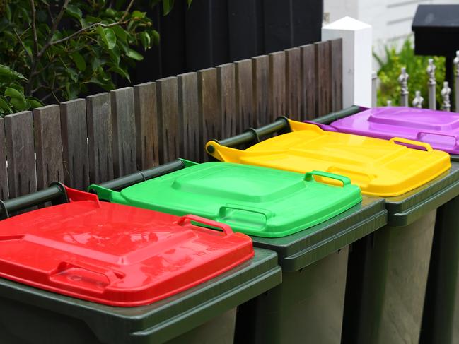 General view of the current and planned waste bins outside a property in Spotswood, Melbourne, Monday, February 24, 2020. Victoria, the only state or territory in Australia without a cash-for-bottles scheme, will get a container deposit scheme - but not for another three years. (AAP Image/James Ross) NO ARCHIVING