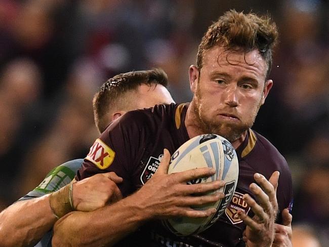 Gavin Cooper of the Maroons is tackled by Damien Cook of the Blues during Game 1 of the 2018 State of Origin series at the MCG in Melbourne, Wednesday, June 6, 2018. (AAP Image/Tracey Nearmy)NO ARCHIVING, EDITORIAL USE ONLY