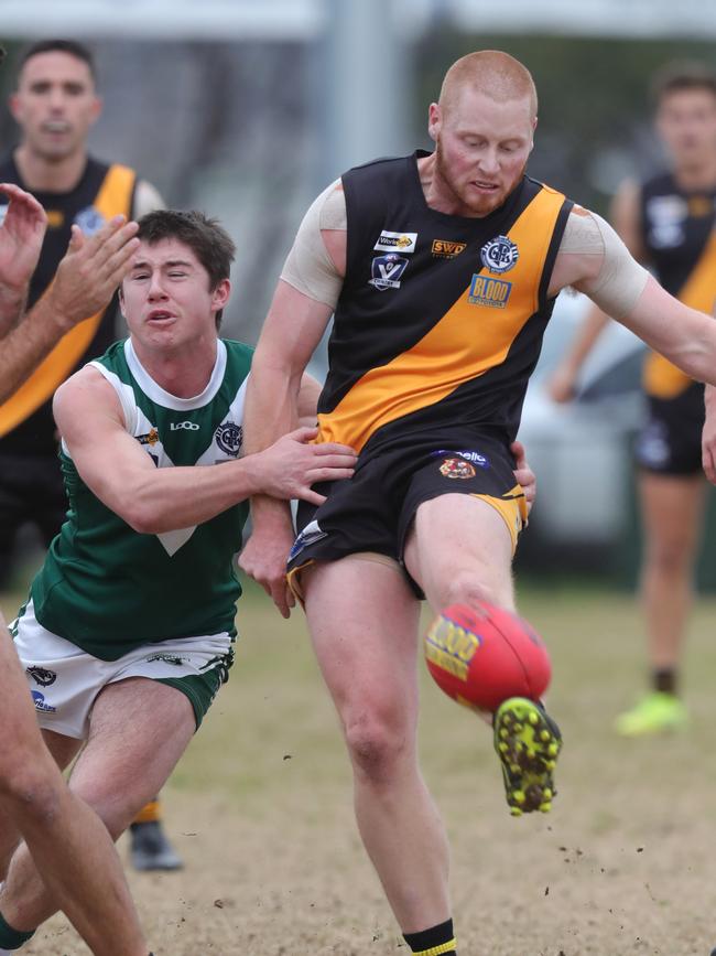 Grovedale’s William Ford (right) gets the kick off under pressure from Bell Park’s Fraser Marris. Picture: Mark Wilson