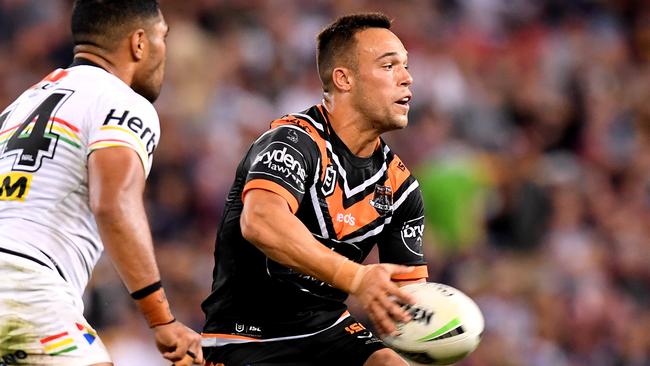 BRISBANE, AUSTRALIA - MAY 10: Luke Brooks of the Tigers passes the ball during the round nine NRL match between the Wests Tigers and the Penrith Panthers at Suncorp Stadium on May 10, 2019 in Brisbane, Australia. (Photo by Bradley Kanaris/Getty Images)