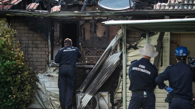 Police and Fire Investigators at the scene of a house fire in Rowe Terrace, Darra where the body of woman was found. PICTURE: Brad Fleet