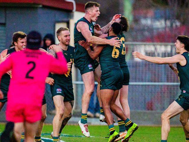 Sam Siggins celebrates the winning goal in Tasmania’s win over Queensland on Saturday. Picture: Linda Higginson