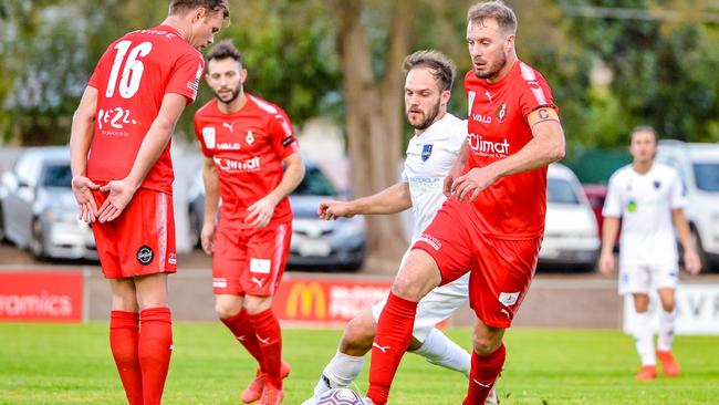 Campbelltown City captain Iain Fyfe in action against Comets at Steve Woodcock Centre on Saturday. Picture: Ken Carter.