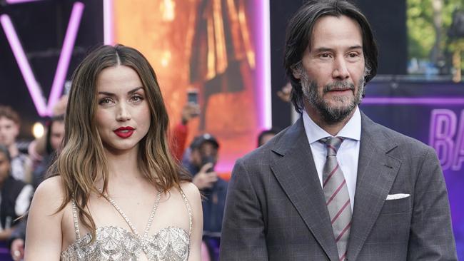 Ana de Armas, left, and Keanu Reeves pose for photographers upon arrival at World premiere of the film 'Ballerina' in London. Picture: Alberto Pezzali/Invision/AP