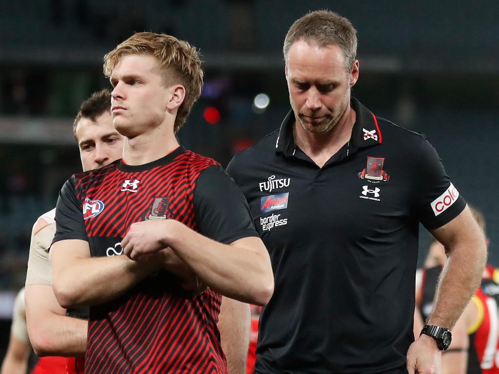 MELBOURNE, AUSTRALIA - AUGUST 14: Ben Rutten, Senior Coach of the Bombers looks dejected after a loss during the 2022 AFL Round 22 match between the Essendon Bombers and the Port Adelaide Power at Marvel Stadium on August 14, 2022 in Melbourne, Australia. (Photo by Michael Willson/AFL Photos via Getty Images)
