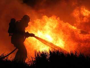 CREWS CALLED: A firefighter works to put out a vegetation fire. Picture: Contributed.