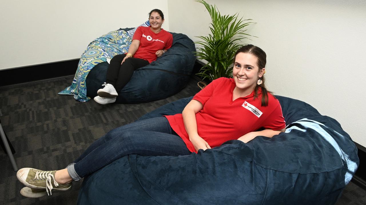 NEW DIGS: Australian Red Cross have relocated to 152 Margaret Street. With new spaces to help clients including special chairs to help with anxiety, Zeynab Aria (back) and Tahlia Bligh. Picture: Bev Lacey