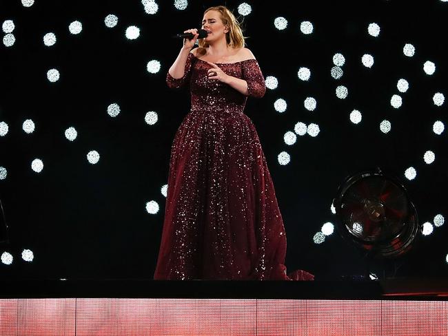 Adele joked that her fan, seen next to her, was not as impressive as Beyonce’s. Picture: Cameron Spencer/Getty Images