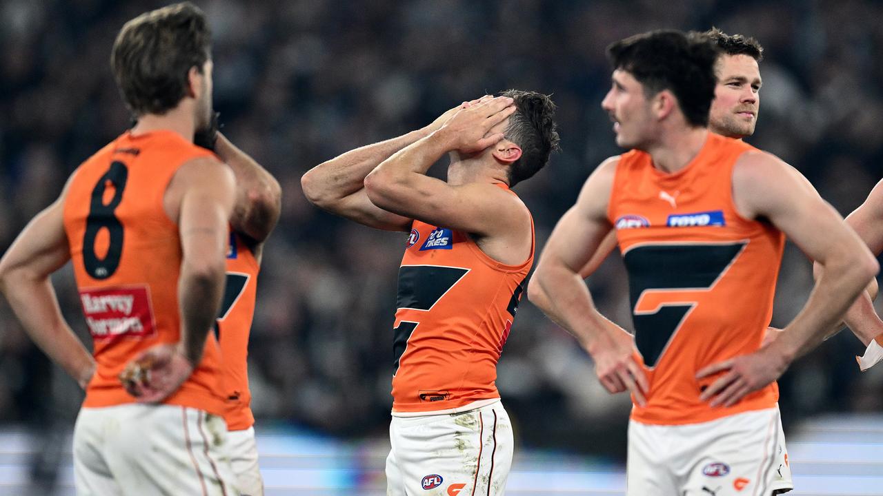 MELBOURNE, AUSTRALIA - SEPTEMBER 22: The Giants look dejected after losing the AFL First Preliminary Final match between Collingwood Magpies and Greater Western Sydney Giants at Melbourne Cricket Ground, on September 22, 2023, in Melbourne, Australia. (Photo by Quinn Rooney/Getty Images)