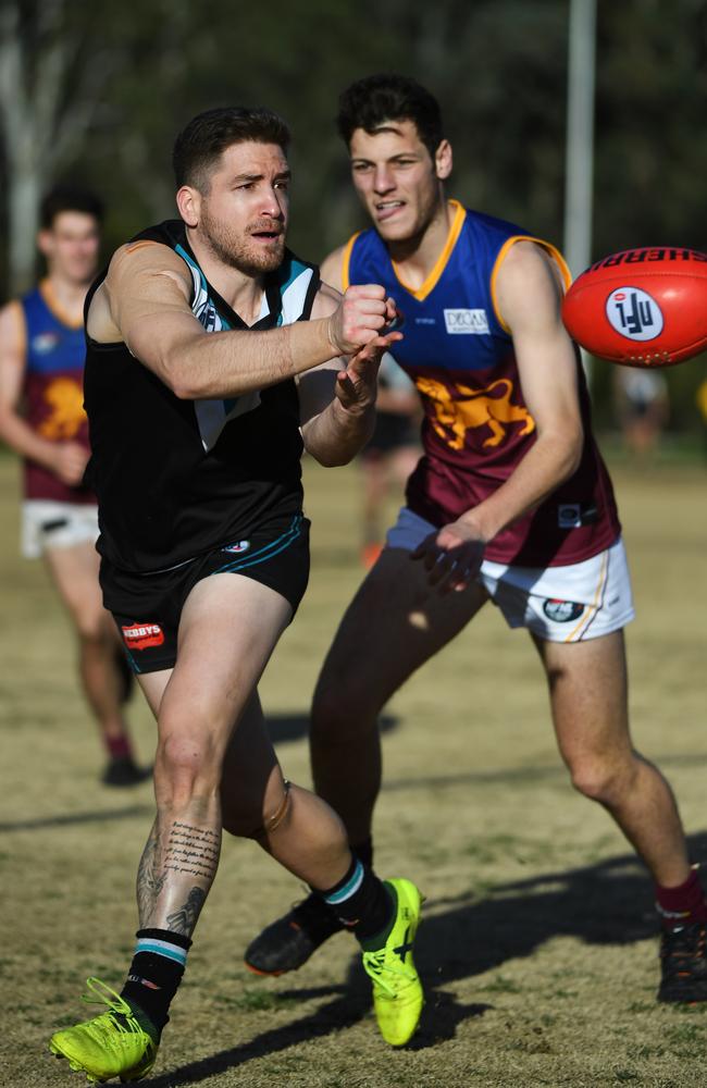 St Mary’s Adam Lucci flicks a sharp handpass off during Saturday’s win over South Morang. Picture: James Ross.