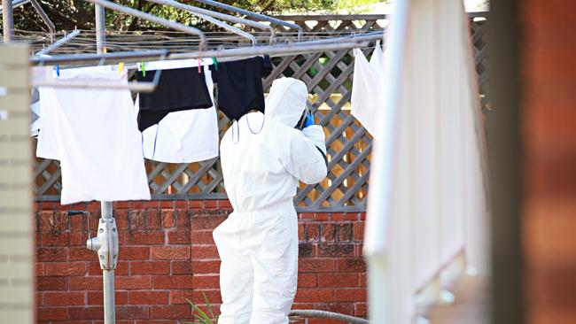 Forensic police investigate the scene. Picture: Adam Yip / Manly Daily