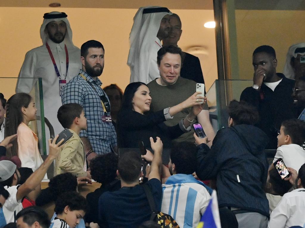 Fans take photos with Elon Musk during the FIFA World Cup match between Argentina and France in Qatar. Picture: Dan Mullan/Getty Images