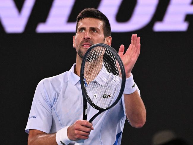 Serbia's Novak Djokovic celebrates victory over Croatia's Dino Prizmic in their men's singles match on day one of the Australian Open tennis tournament in Melbourne on January 14, 2024. (Photo by WILLIAM WEST / AFP) / -- IMAGE RESTRICTED TO EDITORIAL USE - STRICTLY NO COMMERCIAL USE --