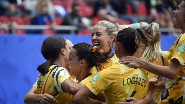 Australian skipper Sam Kerr (L) is congratulated by teammates after scoring a goal against Italy. Picture: AFP