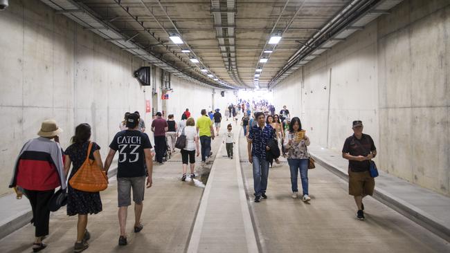 People walk through the new O-Bahn tunnel under Rymill Park on Sunday. Picture: Nick Clayton.