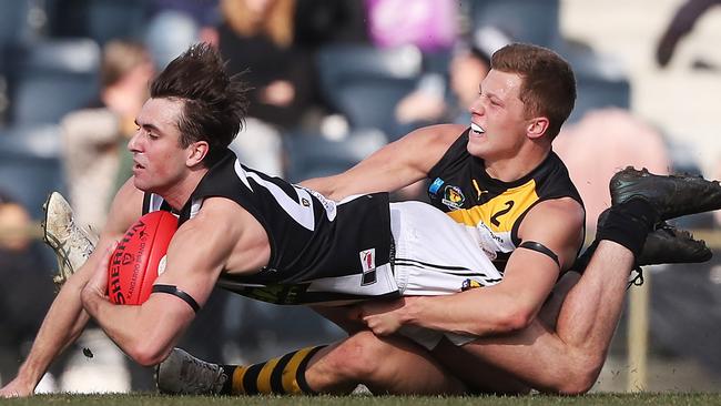 Football. TSL. Tigers V Glenorchy. Ben Kamaric (Glenorchy) is tackled by Tiger Edward Cole. Picture: Nikki Davis-Jones