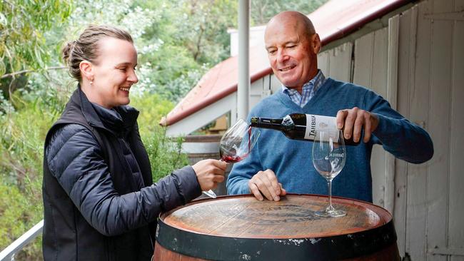 Tahbilk winemaker Alister Purbrick pours a glass for his daughter Hayley.