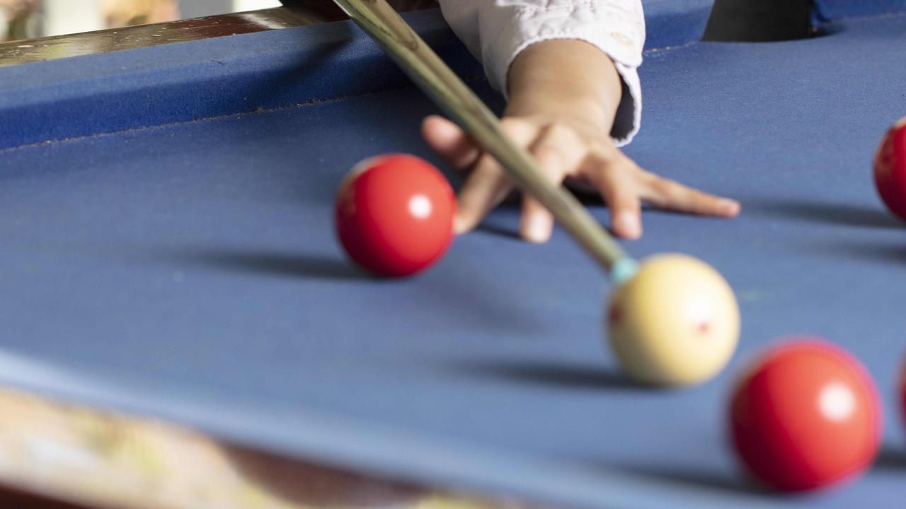 Adelaide woman Susan Stoddard was paid compensation after she was hit in the head with a billiard ball while eating lunch at work last year.