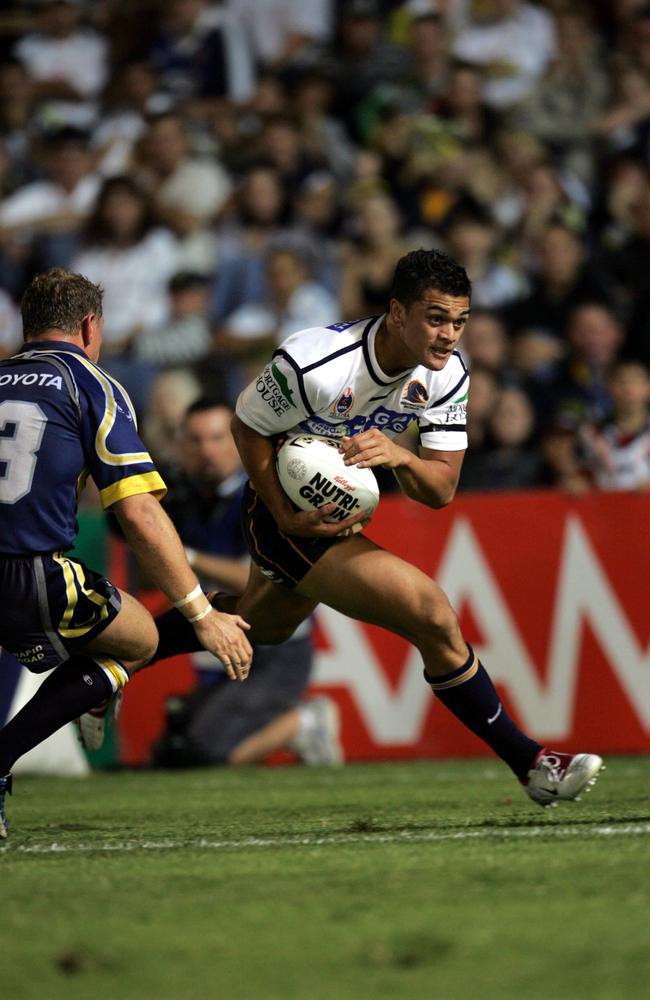 Karmichael Hunt fails to get the ball out from behind the Broncos tryline as he is tackled by Travis Norton and Paul Bowman