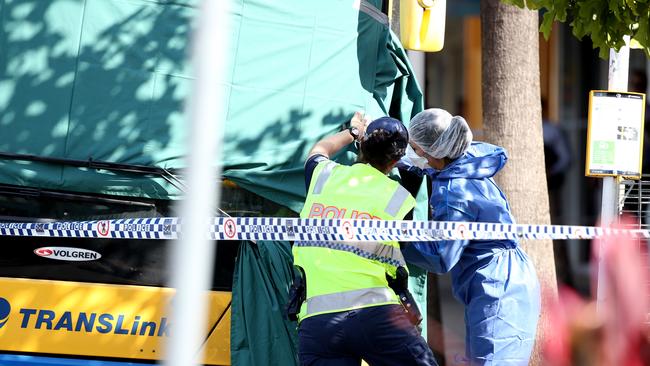 Forensic officers inspect the bus in which Manmeet Sharma was killed. Picture: Tara Croser.