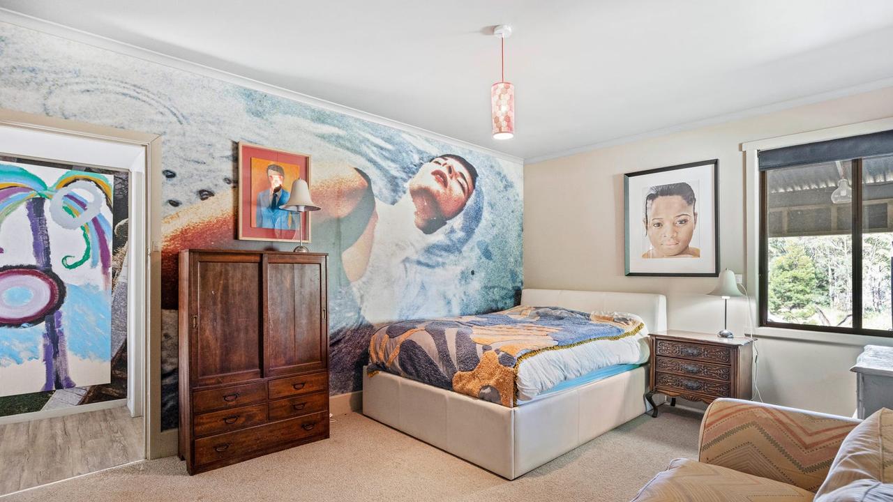 A mural covers the wall in one of the pad’s three bedrooms.