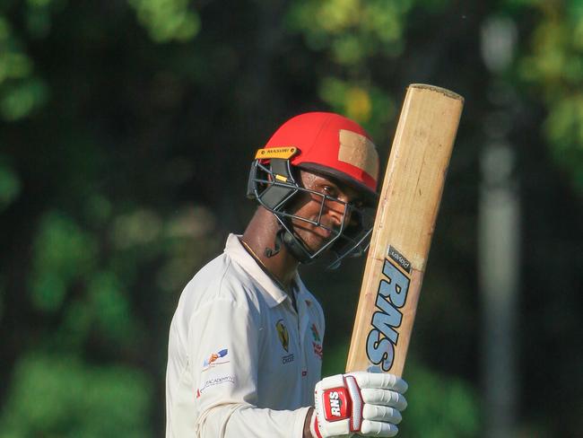 Chandrasinghe raises the bat after his fifth consecutive hundred against Tracy Village. Picture: Glenn Campbell.