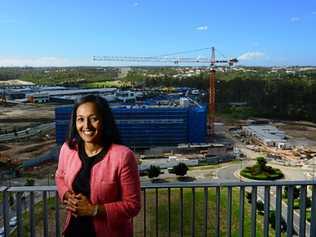 GROWTH: Springfield Land Corporation managing director Raynuha Sinnathamby stands before the changing landscape of Springfield. Picture: David Nielsen