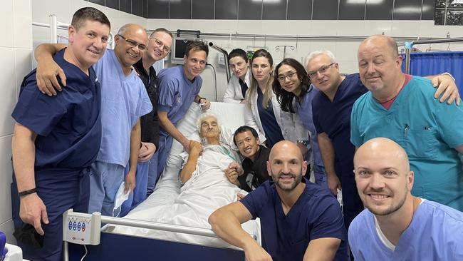 Medical staff surround the first patient to receive the Anteris aortic valve. CEO Wayne Paterson is at left.