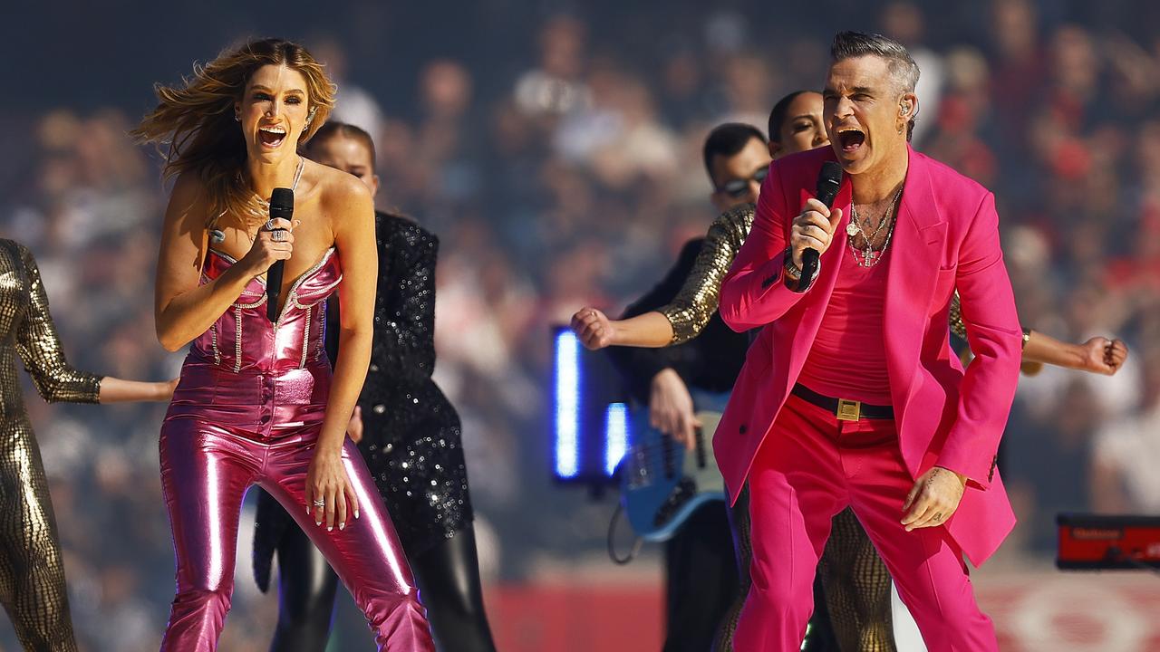 Robbie Williams and Delta Goodrem perform during the grand final. Picture: Daniel Pockett/AFL Photos/via Getty Images