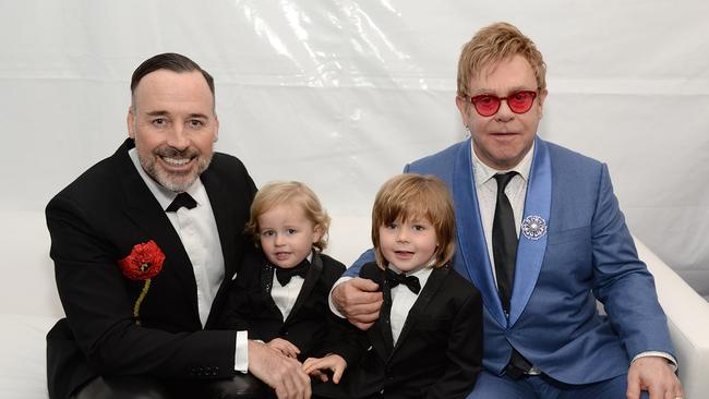 David Furnish, Elijah Furnish-John, Zachary Furnish-John, and Sir Elton John. (Photo by Michael Kovac/Getty Images for EJAF)