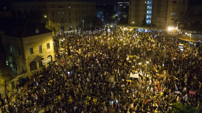 Thousands of Israelis protest against Prime Minister Benjamin Netanyahu in Jerusalem on Saturday. Picture: Getty Images