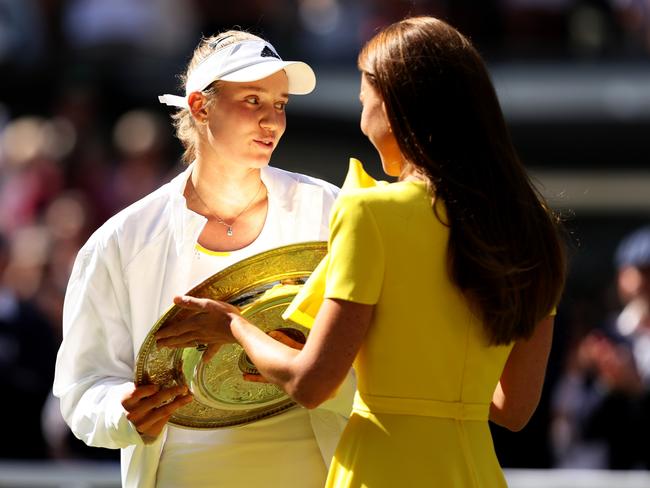 LONDON, ENGLAND - JULY 09: Elena Rybakina of Kazakhstan is presented with the trophy by HRH Catherine, The Duchess of Cambridge after victory against Ons Jabeur of Tunisia during the Ladies' Singles Final match on day thirteen of The Championships Wimbledon 2022 at All England Lawn Tennis and Croquet Club on July 09, 2022 in London, England. (Photo by Clive Brunskill/Getty Images)