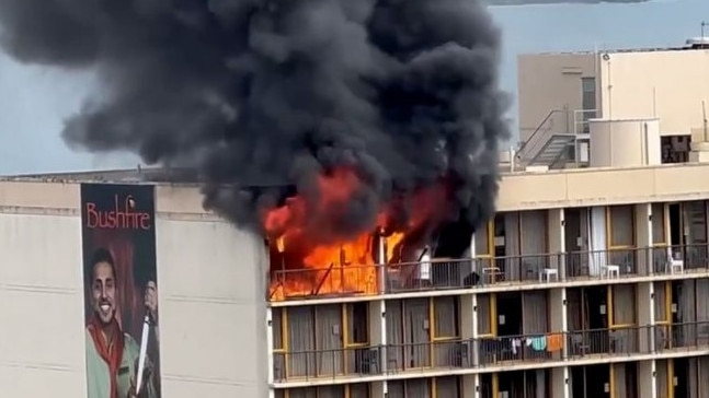 A woman has been charged with arson after fire gutted two rooms on the top floor of a Cairns quarantine hotel. Picture supplied via Nine News