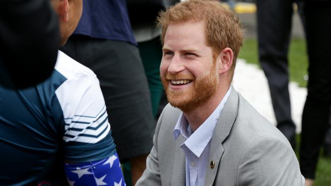 Prince Harry meets Invictus Games competitors from the US at the cycling competition at the Royal Botanic Garden, Sydney. Picture: Jonathan Ng