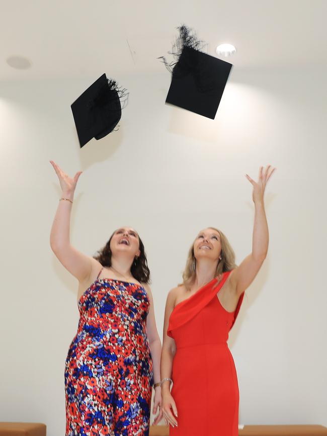 Sarah Calgaro and Bianca Conway at the CQU Cairns mid-year graduatiion ceremony, held at the Cairns Convention Centre. Picture: Brendan Radke