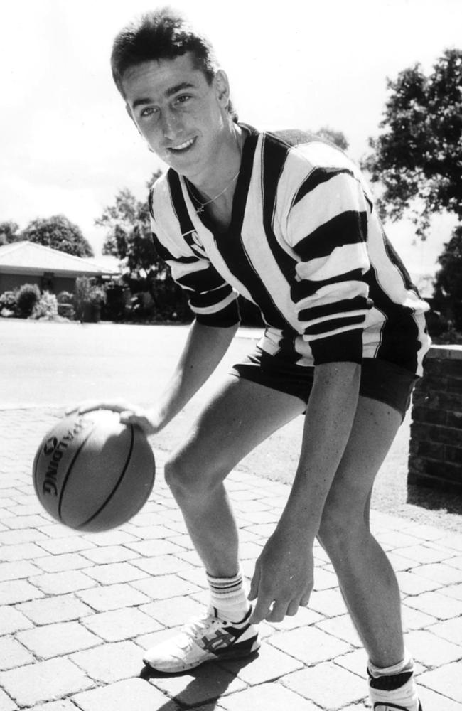 Former AFL player now a Basketball player Brendan Le Gassick wearing his father's Collingwood jumper. Jan 1989 f/l alone sport basketball 35/N/8989